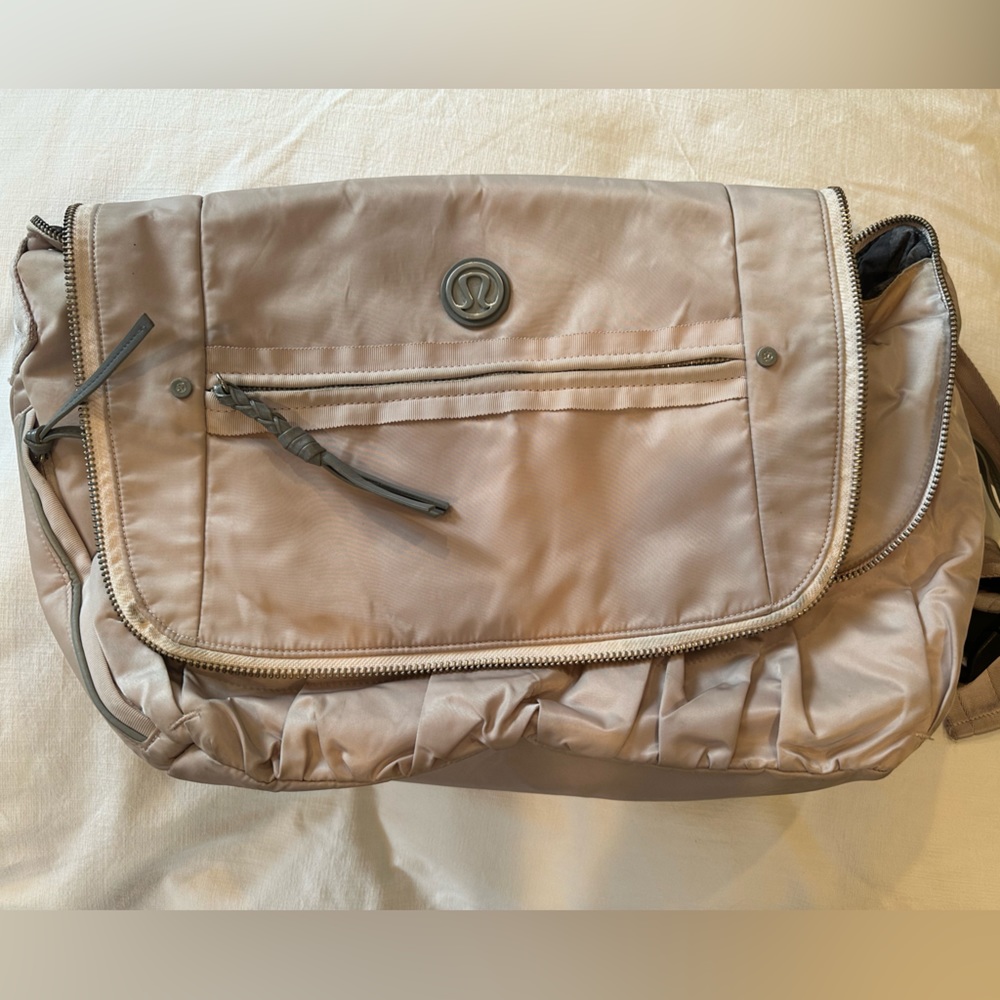Rare blush messenger bag.